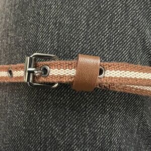 Woven Thin brown belt with cream stripe and grommet holes.  32"-36"